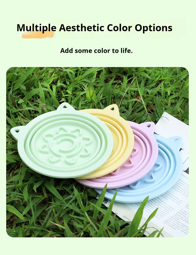 Collapsible travel dog bowl in silicone, folded flat with hook for easy carrying