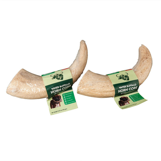 Two natural water buffalo horns for dogs chew treats on a white background