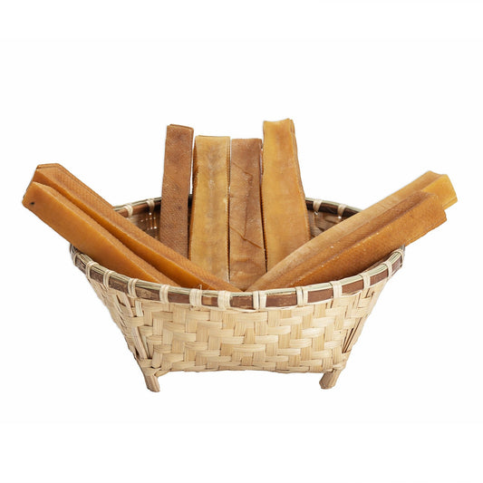 Pack of 15 natural dog stick treats made from yak and cow milk promoting dental health and long-lasting chew for all dog breeds