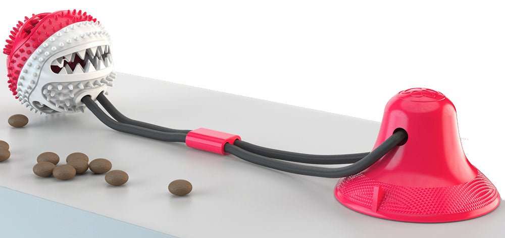 Ball-shaped suction cup dog treat dispenser toy with ridges and dual-rope strings for interactive play and dental care.