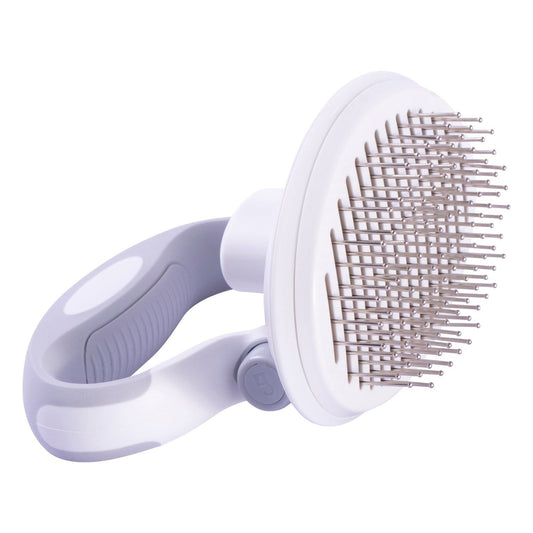 Compact dog brush with rotating handle and self-cleaning eject button for travel use