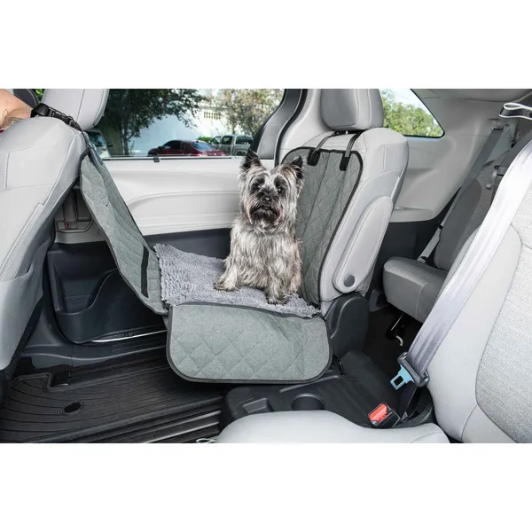 44" x 35" x 2" single car seat cover with cozy microfiber fabric and waterproof Oxford backrest, featuring side flaps and a small dog sitting on it in a car seat.