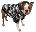 Dog wearing insulated parka coat with removable faux fur hood and belly Velcro closures for cold weather